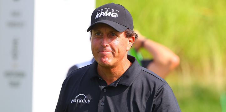 Phil Mickelson looks on