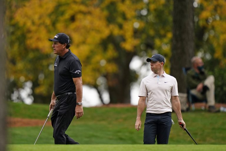 Phil Mickelson, left, has backed Rory McIlroy to win the Masters but it might not be this year 