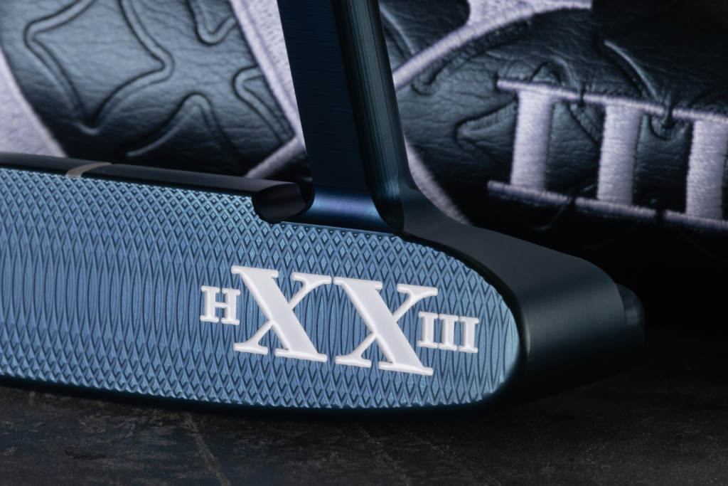 A close up on the heel engraving on the Mystic Blue Scotty Cameron HXXIII Newport Putter