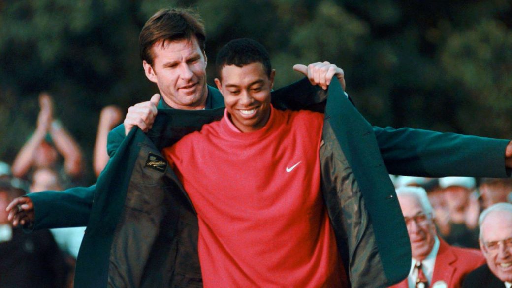 Nick Faldo hands Tiger Woods the Masters Green Jacket