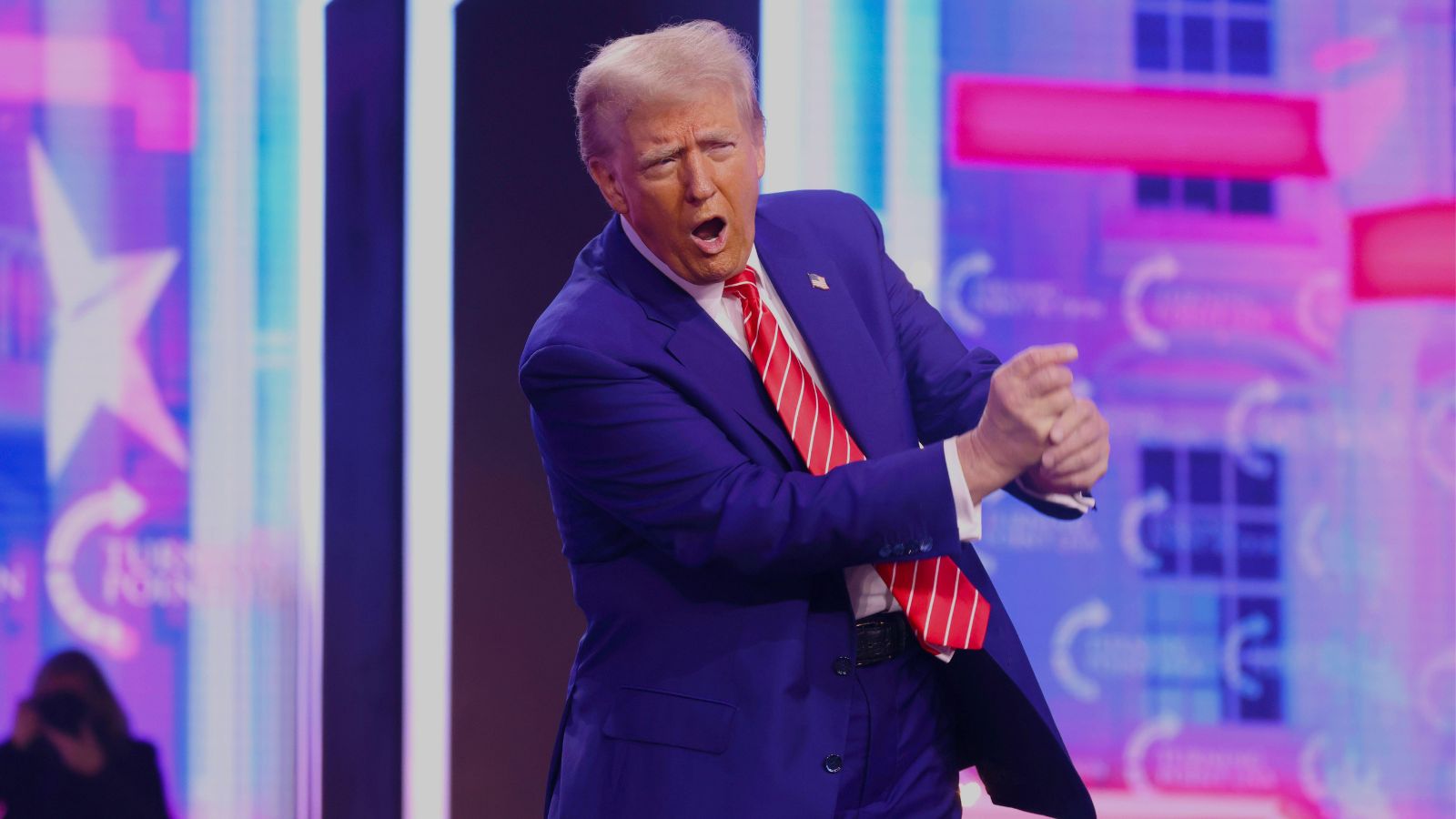 Donald Trump imitates a golf swing and announces he will attend Ryder Cup 2025.