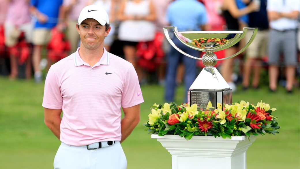 Rory McIlroy with the FedEx Cup next to him.
