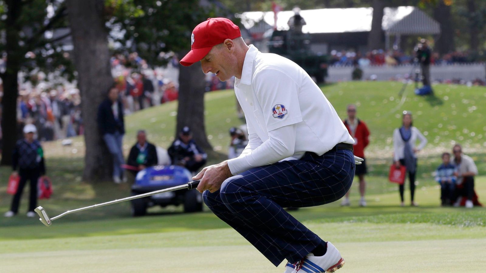 Jim Furyk misses a putt and sinks to his knees after losing.