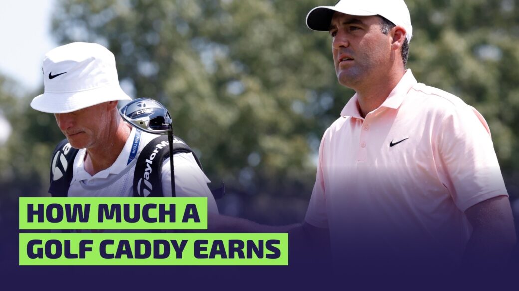 Scottie Scheffler of United States hands his driver to caddie Ted Scott after teeing off No. 9 during the first round of the FedEx St. Jude Championship
