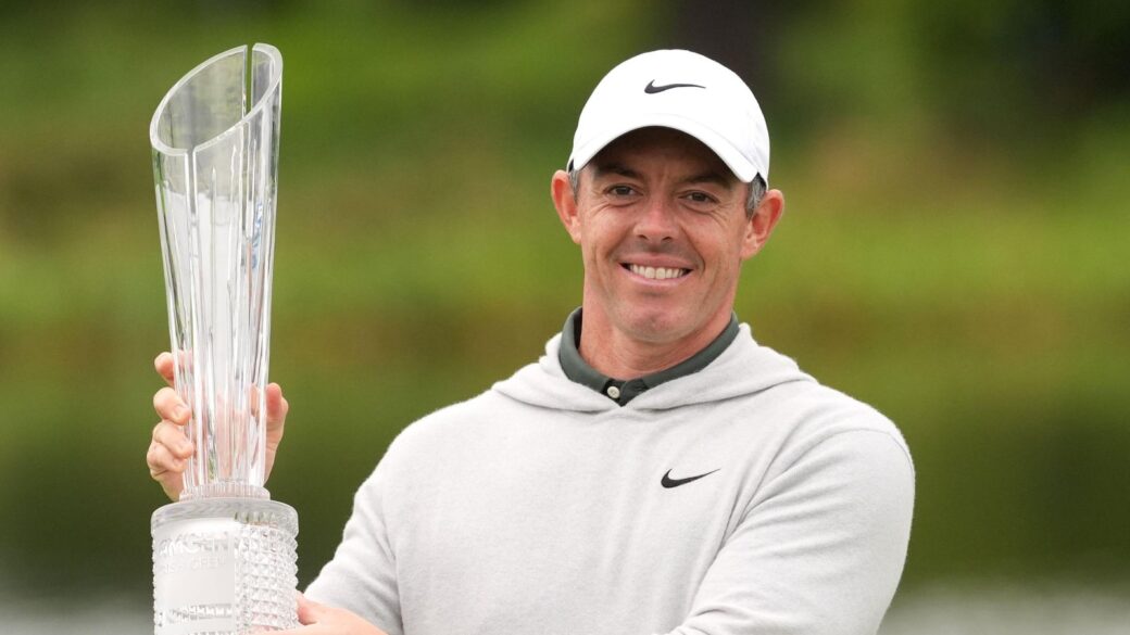 Rory McIlroy celebrates with 2025 Irish Open trophy after a playoff victory over Joakim Lagergren at The K Club, Ireland