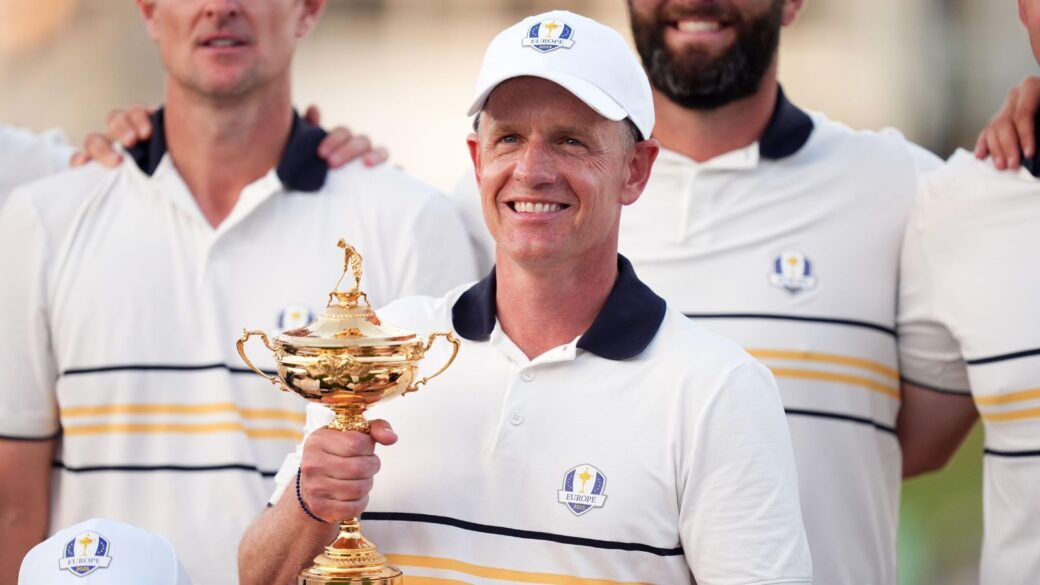 Luke Donald pictured holding the Ryder Cup trophy