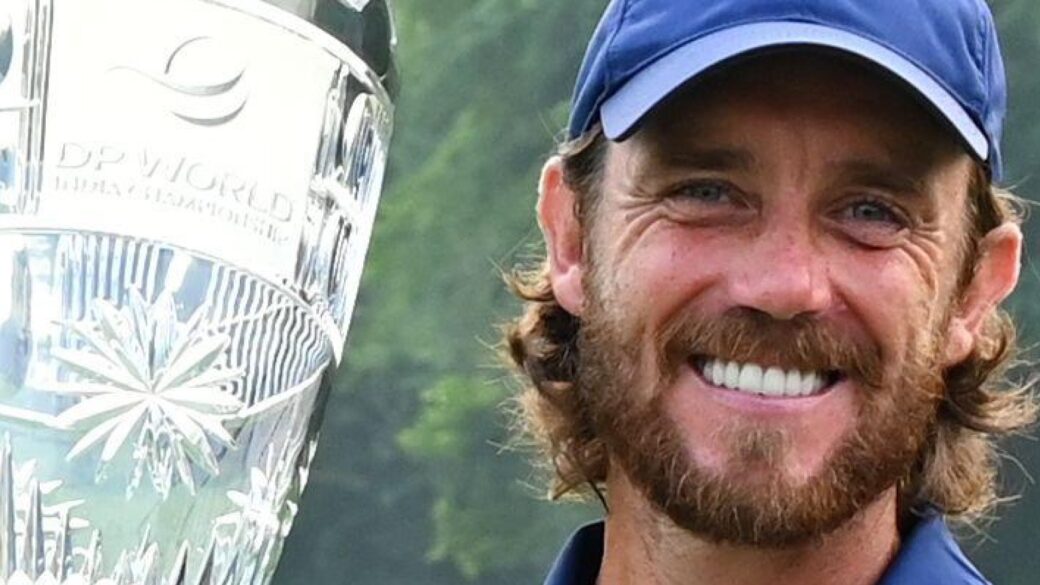 Tommy Fleetwood of England poses with the trophy after wining the DP World Tour Championship golf tournament in New Delhi