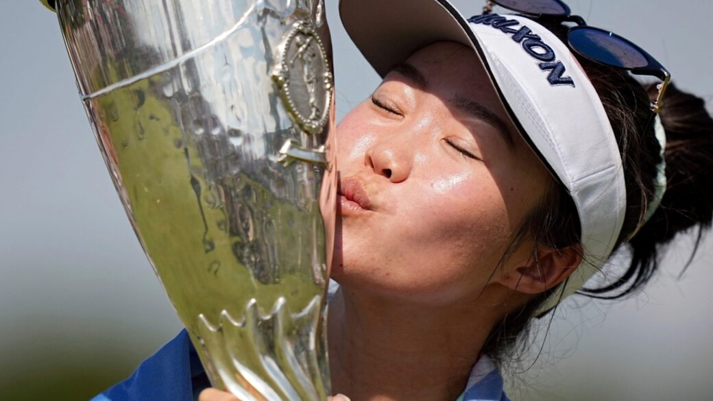 Grace Kim, of Australia, kisses her trophy after winning the Evian Championship women's golf tournament