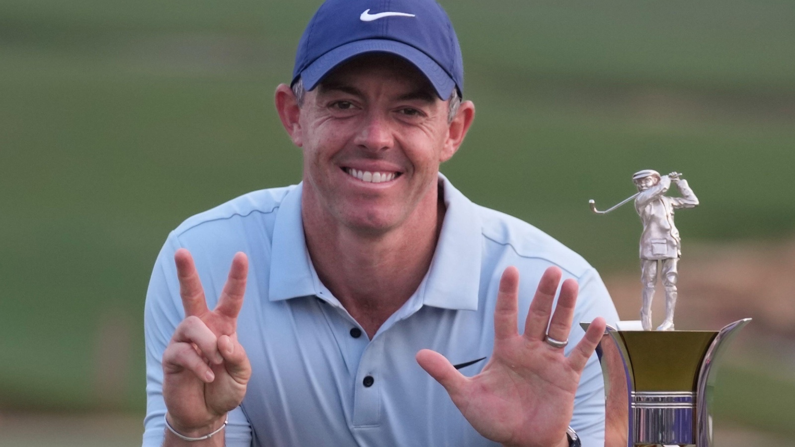 Rory McIlroy of Northern Ireland poses with Race to Dubai trophy in Dubai, United Arab Emirates
