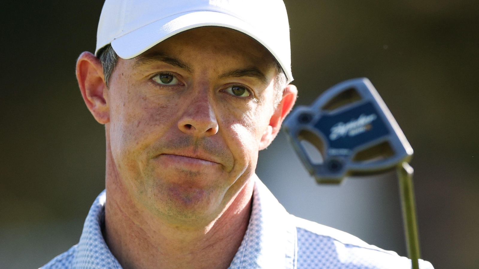 ORY MCILROY walks off the 17th green after scoring a birdie during the final round of the Genesis Invitational
