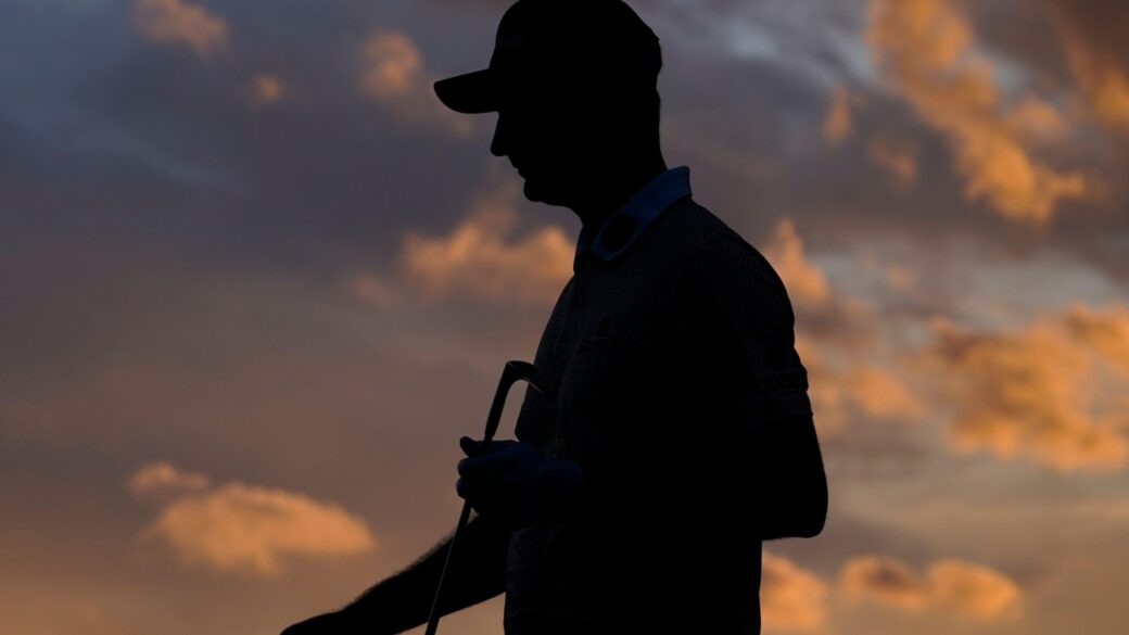 Justin Rose, of England, walks on the 18th green during the third round of the Masters golf tournament