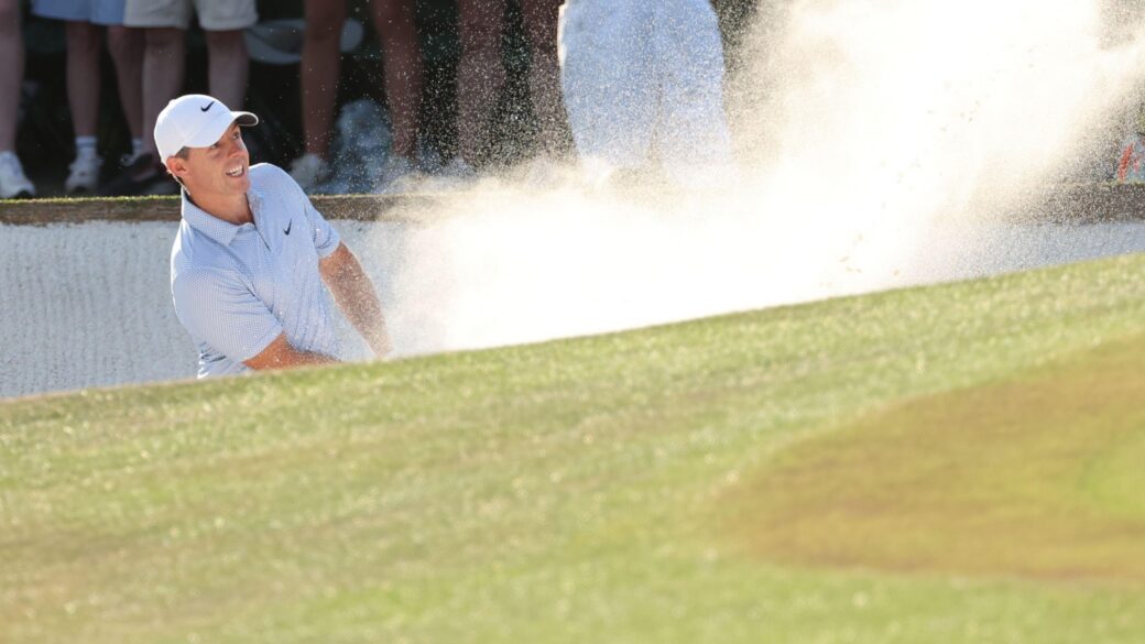 Rory McIlroy wedges out of a bunker at The Masters